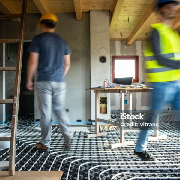 Working at construction site in blurred motion,underfloor heating